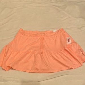 New skorts. Skirt with built in shorts. In peach color.